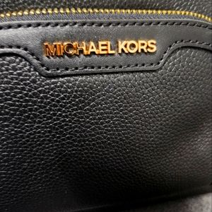 Michael Kors black leather womens backpack.